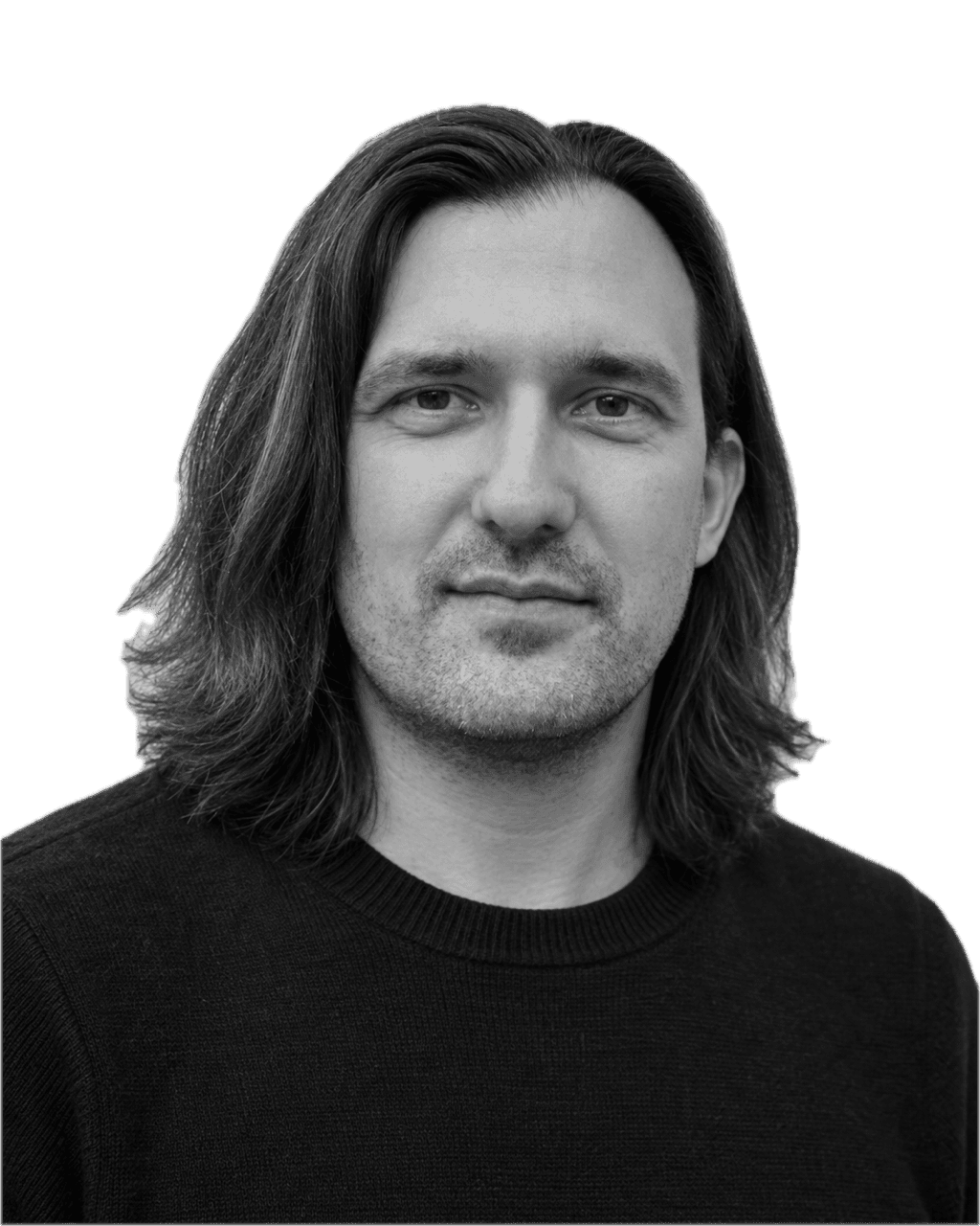 Philip Müller, with long hair and a slight smile